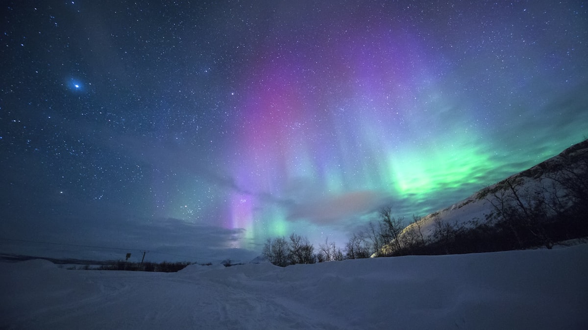 A generational peak in aurora activity is drawing travelers north in search of the night sky.
